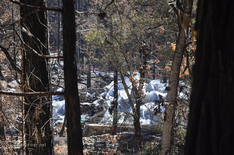 DSC_0787.JPG - Remains of dining hall covered with plastic to prevent Haz Mat into river